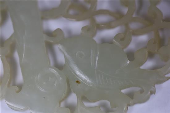 A Chinese pale celadon jade fish plaque, 19th century 6cm, wood stand